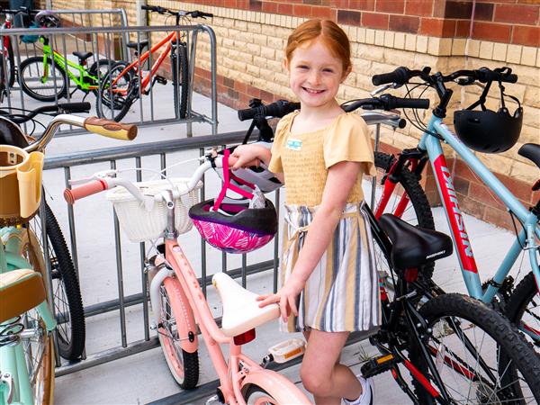 Students bike to school in the morning.